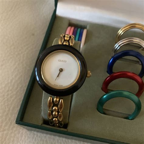 gucci watch with changeable bezels.